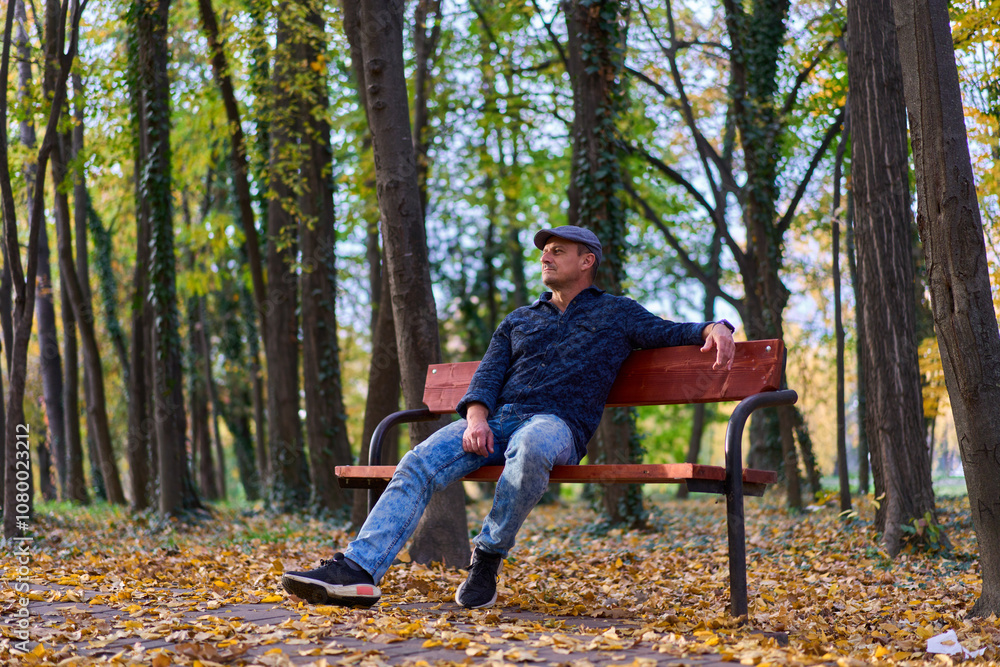 Mature man in the park on a bench Mature man in the park on a bench