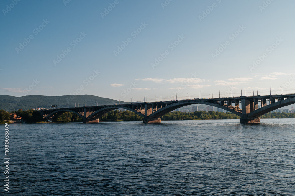 communal bridge over the Yenisei River in Krasnoyarsk at dawn communal bridge over the Yenisei River in Krasnoyarsk at dawn