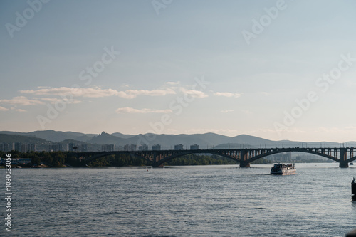 communal bridge over the Yenisei River in Krasnoyarsk at dawn photo