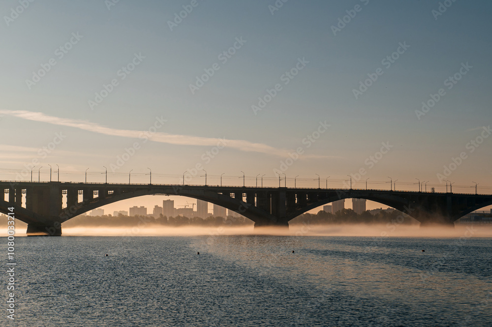 Naklejka premium communal bridge over the Yenisei River in Krasnoyarsk at dawn