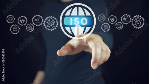 ISO Certification Concept. Businessman touch representation of ISO certification, icons symbolizing quality assurance, compliance, global standards, and International organization for standardization. photo