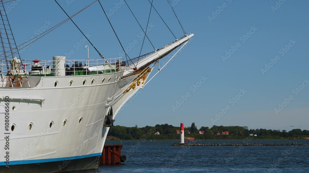 bow of large sailing boat with pier lights in the background at the harbor bow of large sailing boat with pier lights in the background at the harbor