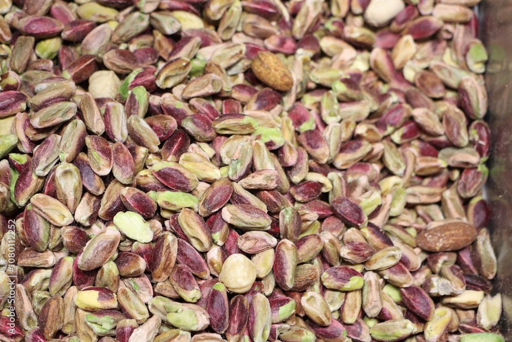 Enjoy the Vibrant and Flavorful Pistachio Nuts Displayed in a Beautiful Rustic Setting Enjoy the Vibrant and Flavorful Pistachio Nuts Displayed in a Beautiful Rustic Setting