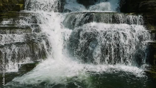 Scenic landscape in slow motion of water stream with splash. Tinuy-an Falls. Surigao del Sur. Philippines. photo