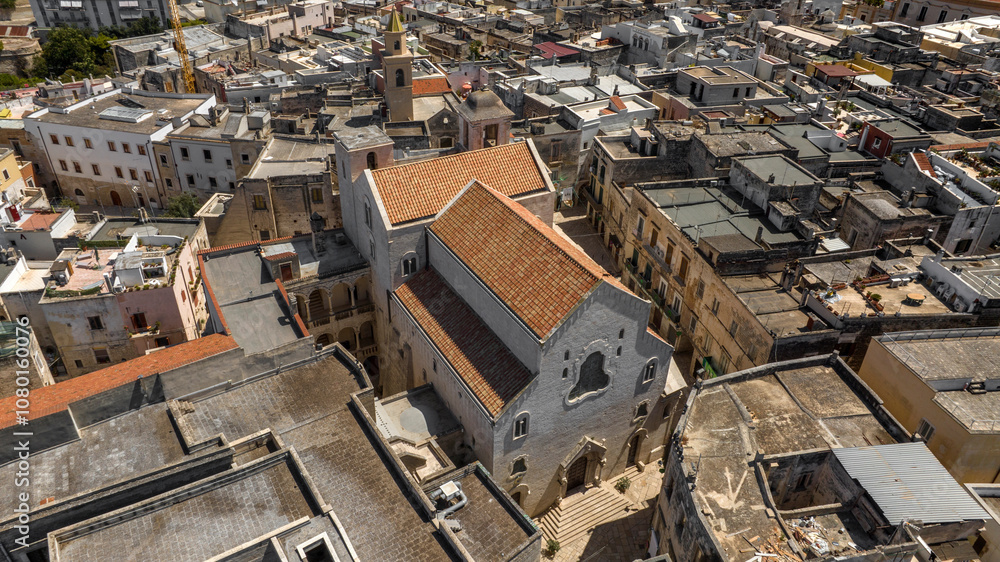 Fototapeta premium Aerial view of the Cathedral of Bisceglie, in Puglia, Italy. The Romanesque church of Saint Peter Apostle is located in the historic center of the town.