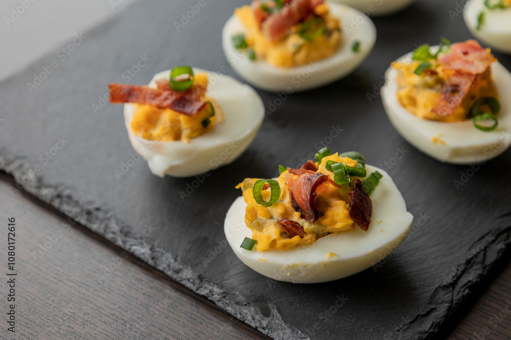 deviled eggs topped with crispy bacon and green onion, creating a savory and colorful appetizer. Perfect for party starters, gatherings, or holiday platters deviled eggs topped with crispy bacon and green onion, creating a savory and colorful appetizer. Perfect for party starters, gatherings, or holiday platters