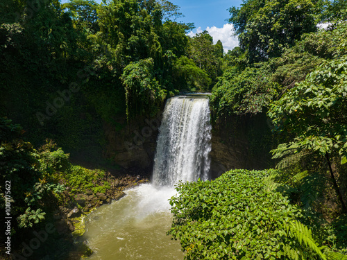 Aerial view of waterfall in Lake Sebu. Falls surrounded by lush vegetation and towering mountains. Mindanao, Philippines. photo