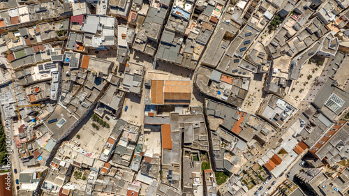 Aerial perpendicular view of the Cathedral of Bisceglie, in Puglia, Italy. The Romanesque church of Saint Peter Apostle is located in the historic center of the town.