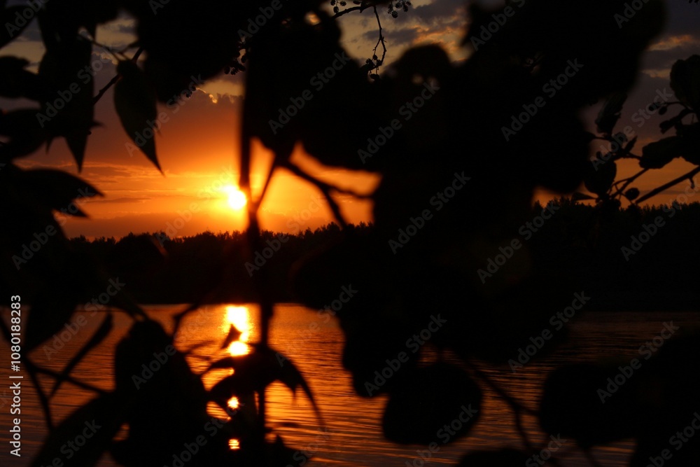 Fototapeta premium Orange sunset over the lake, beautiful abstract nature background, landscape, bright sky, spring warm evening, bright colors of spring, water, reflection, sun rays, fiery sunset, inspiration, horizon