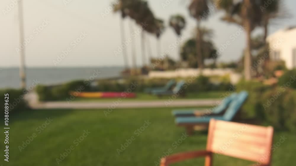two hands holding glasses of beer in the background of sunset over the sea two hands holding glasses of beer in the background of sunset over the sea