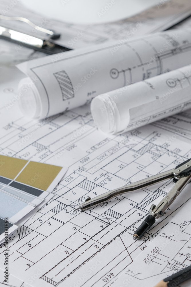 Architects concept,eco project house,Retrofit movement,engineer architect designer working drawing sketch plans blueprints and making construction eco model Architects concept,eco project house,Retrofit movement,engineer architect designer working drawing sketch plans blueprints and making construction eco model