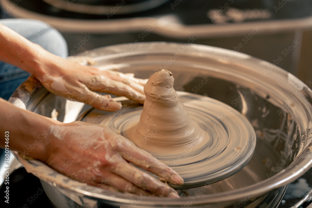close up the clay modeling studio young girl hands giving shape to clay on a potter's wheel applied art clayware old craftsmanship close up the clay modeling studio young girl hands giving shape to clay on a potter's wheel applied art clayware old craftsmanship