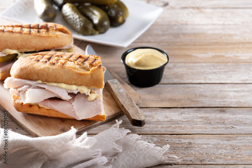 Traditional Cuban sandwich on wooden table. Copy space photo