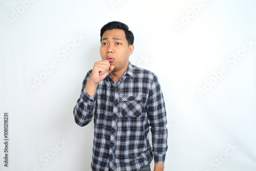 unhealthy asian man coughing feeling unwell isolated on white background wearing casual shirt