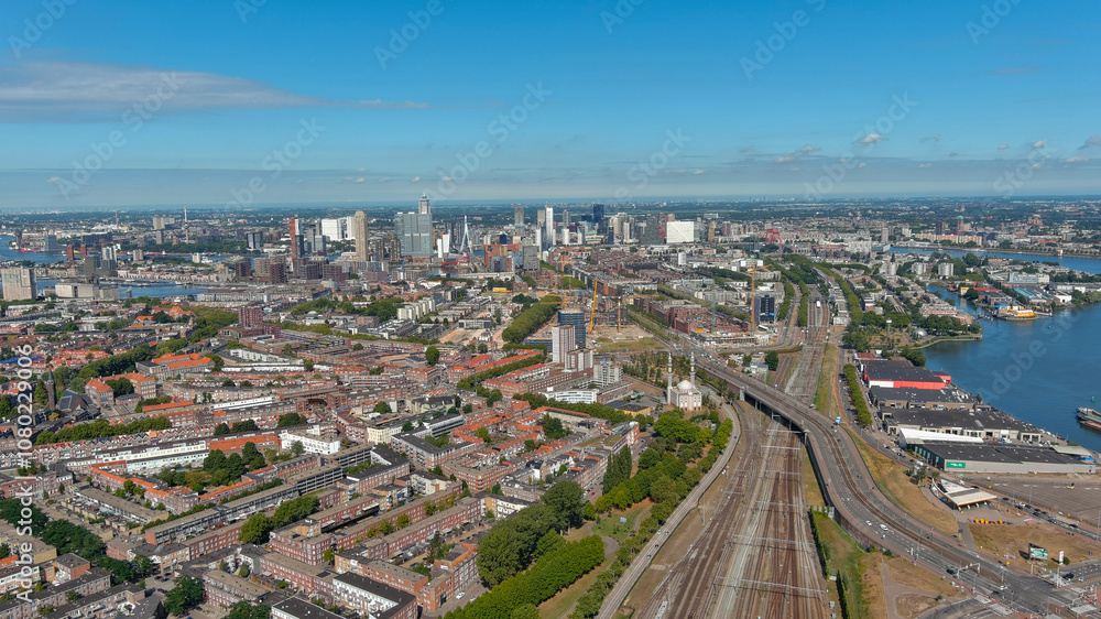 Expansive aerial view of Rotterdam’s residential and industrial zones, showcasing urban connectivity and waterways Expansive aerial view of Rotterdam’s residential and industrial zones, showcasing urban connectivity and waterways