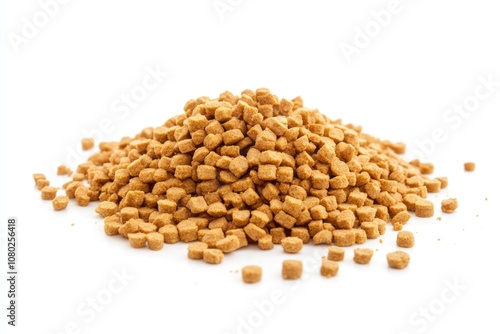 A pile of brown sugar cubes on a white surface