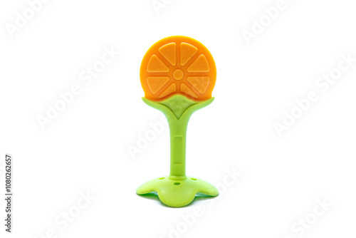 orange-shaped rubberized baby bite toy on white background photo