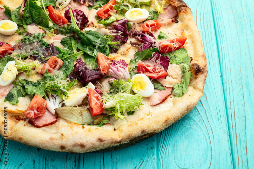 Italian pizza caesar with eggs salad chicken tomatoes and mozzarella photography. top view Italian pizza caesar with eggs salad chicken tomatoes and mozzarella photography. top view