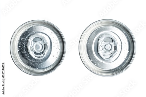 Close-up of two soda cans on a white surface