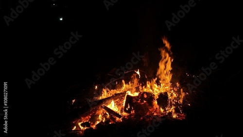 fire burns on the street at night  photo