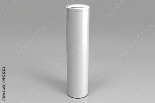 A white canister with a lid sits on a white background photo