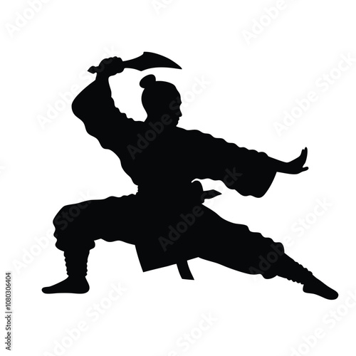 A man in a black outfit is doing a martial arts pose. He is holding his arms out to the side and has his hands in the air