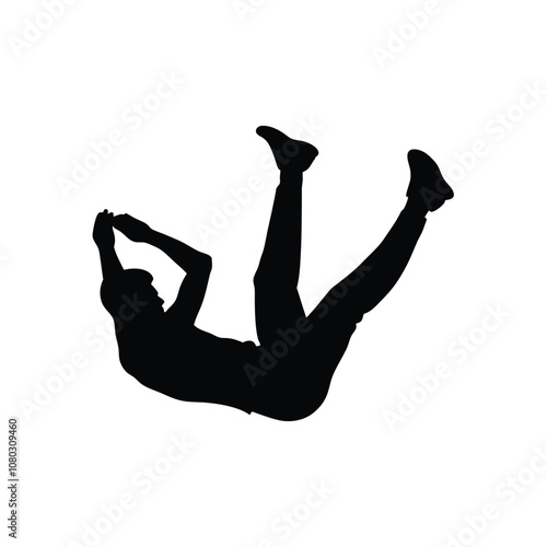 A man is falling down and holding a bottle. He is wearing black shorts and a black shirt