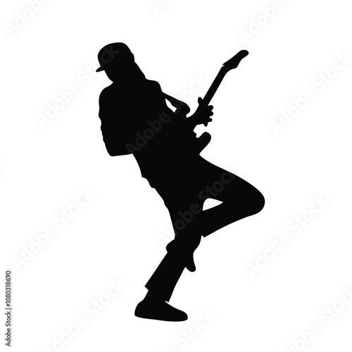 A man playing a saxophone. He is wearing a hat and is bending over. The saxophone is in his right hand