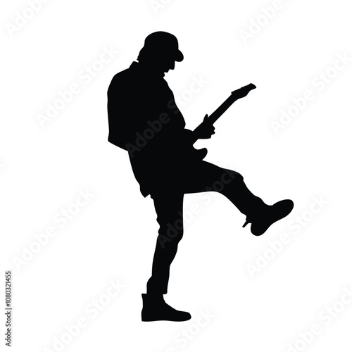 A man playing a saxophone. He is wearing a hat and is bending over. The saxophone is in his right hand