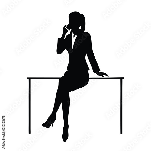 A woman is sitting on a desk and talking on her cell phone. She is wearing a suit and heels