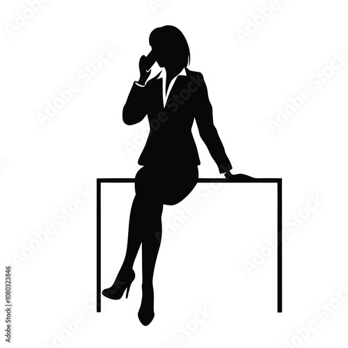A woman is sitting on a desk and talking on her cell phone. She is wearing a suit and heels