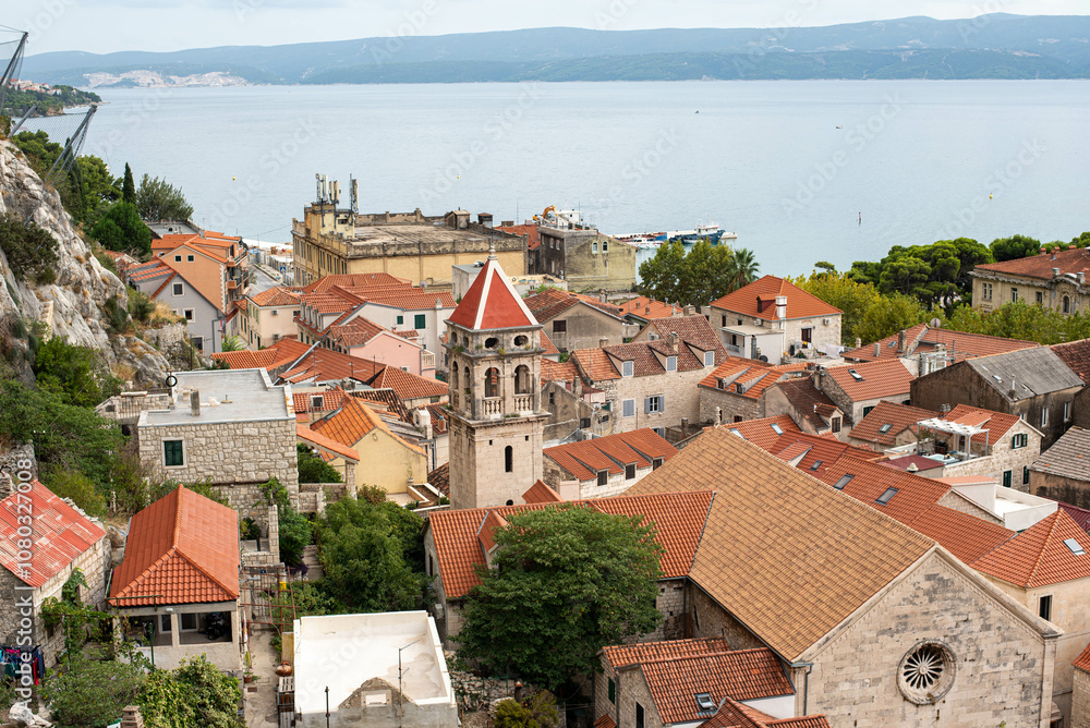 Fototapeta premium View over the historic town of Omis from Peovica Fortress, Croatia, capturing stunning Adriatic coastal scenery