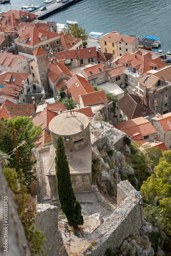 Fortress Peovica (Mirabela) overlooks Omis, Croatia, offering scenic views of the town, sea, and nearby mountains. photo