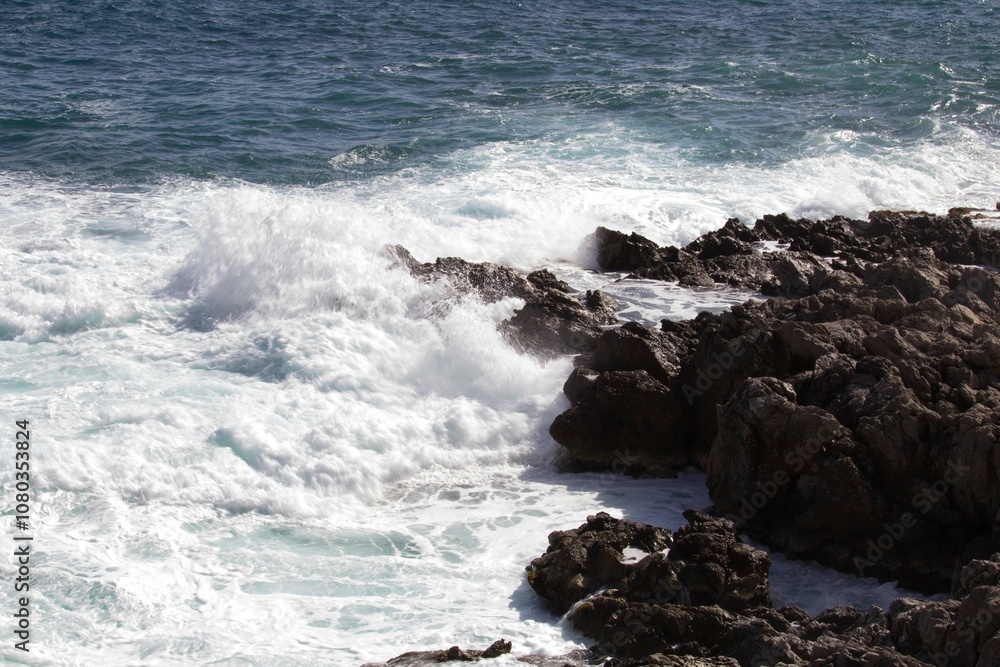 evocative image of a rough sea hitting the rocks in Sicily evocative image of a rough sea hitting the rocks in Sicily