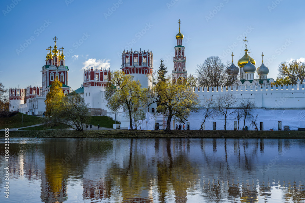 View of the Theotokos-Smolensky Novodevichy Convent of the 16th century in Moscow on an autumn sunny day from the side of Novodevichy Pond