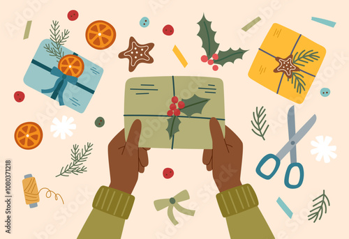 Sustainable Christmas concept. Eco friendly packaging of Christmas gift. Hands holding a wrapped Christmas present.