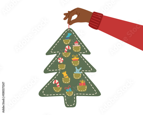 Sustainable Christmas concept. Eco friendly handmade Christmas tree with gifts in human hand isolated on white. Advent calendar.