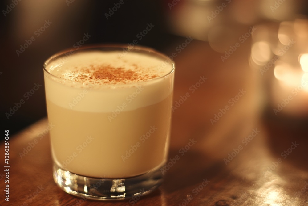 eggnog in glass on table, traditional Christmas drink eggnog in glass on table, traditional Christmas drink