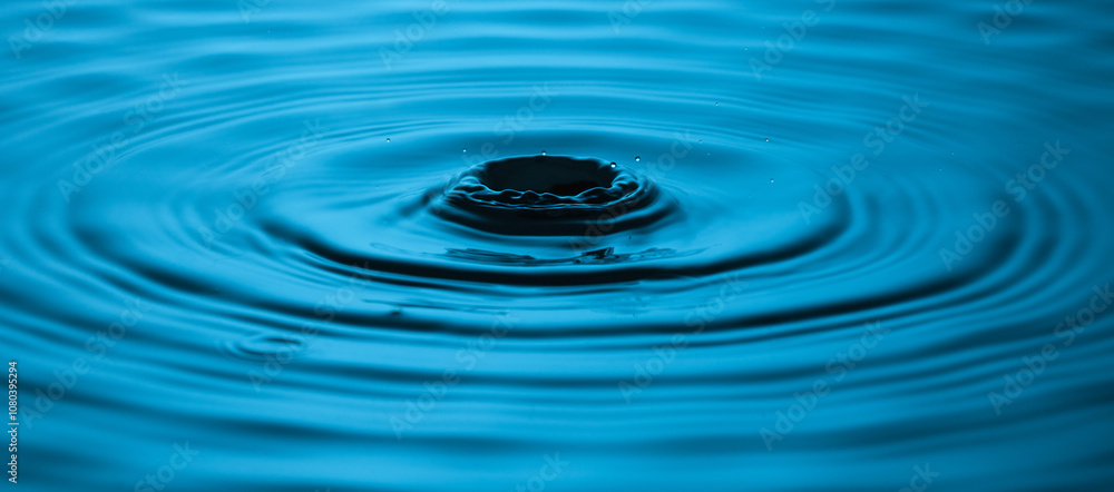 Blue Water drop falling, macro splash. Natural background. Crown drop Blue Water drop falling, macro splash. Natural background. Crown drop