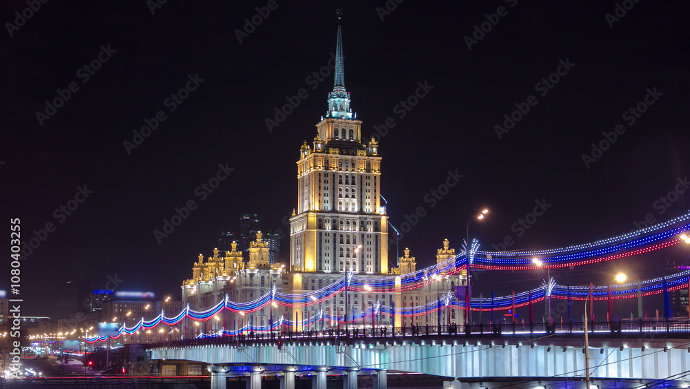 Fototapeta premium Hotel Ukraine winter night timelapse hyperlapse with bridge over Moscow River.