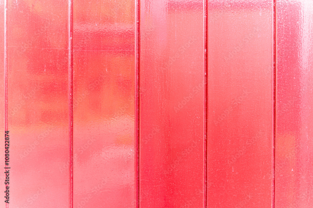 Fototapeta premium Painted shiny red wood wall outside.