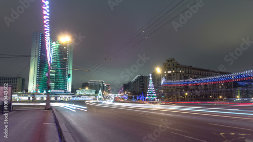 Buildings at New Arbat Street winter night timelapse. New Arbat is located in the central part of Moscow photo