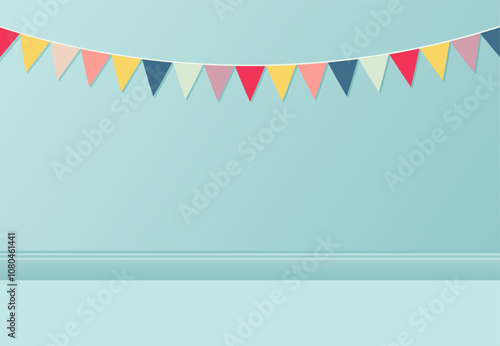 Abstract colorful fabric party flag hanging on blue wall background. Congratulatory background with place for text.