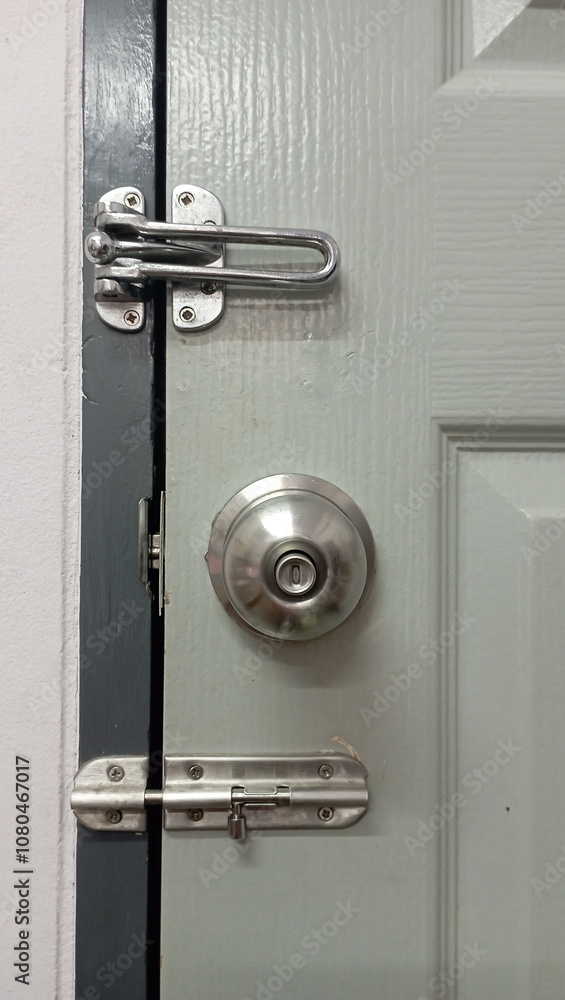 A door with a doorknob and deadbolt,secure metal door, deadbolt lock, home security A door with a doorknob and deadbolt,secure metal door, deadbolt lock, home security