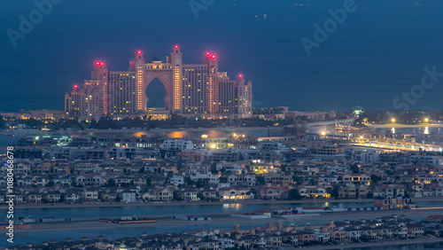 Jumeirah Palm Island night to day timelapse dubai shot from the rooftop top of the tower in dubai marina, uae photo