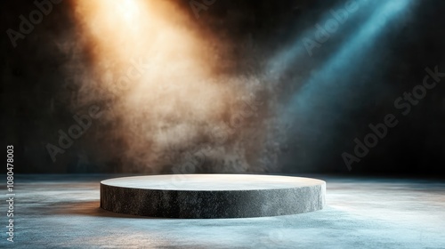 An empty circular stage is lit by two distinct spotlights in contrasting colors, creating a dramatic mood and inviting anticipation for a forthcoming performance. photo