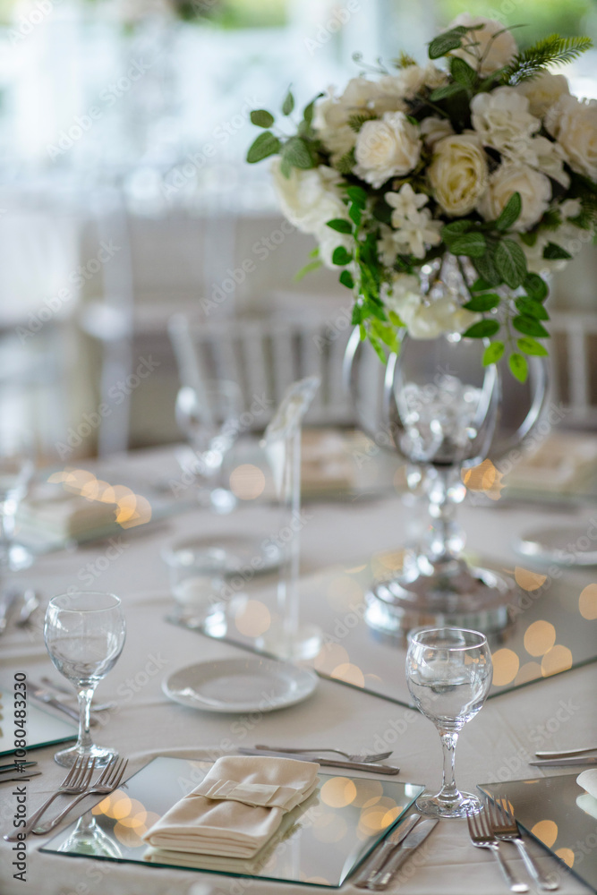 Elegant Table Setting with Pastel Flowers and Silver Centerpieces Elegant Table Setting with Pastel Flowers and Silver Centerpieces