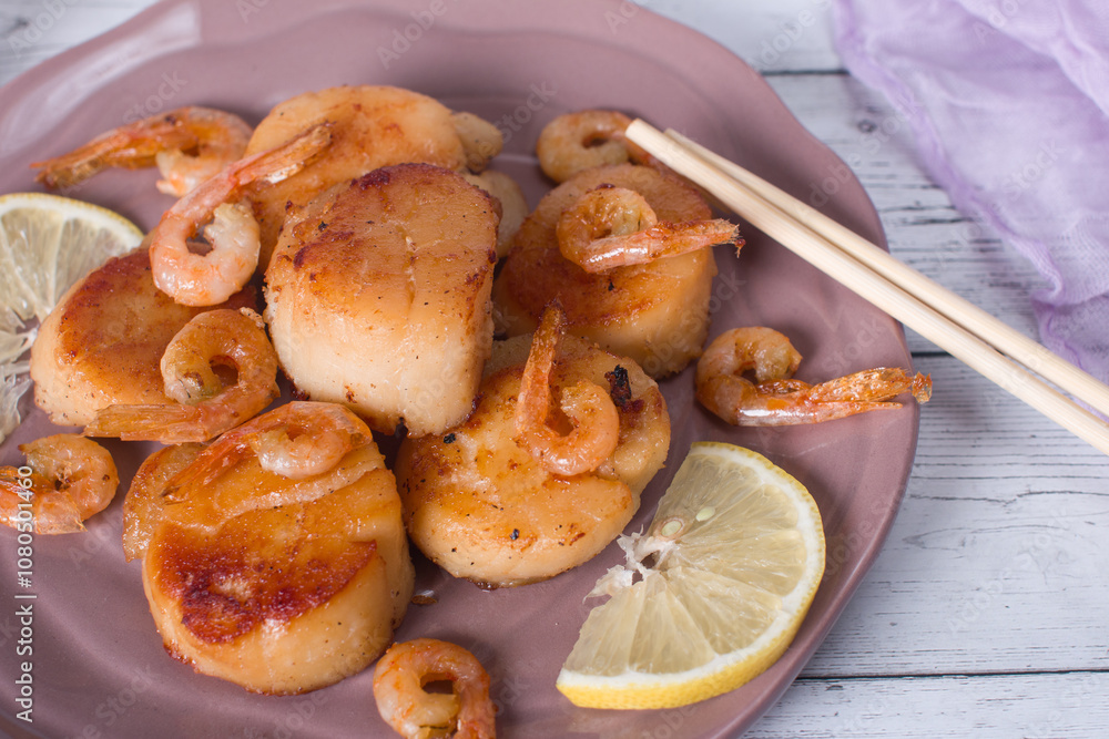 fried scallops on a plate, seafood. Serving dishes in the restaurant