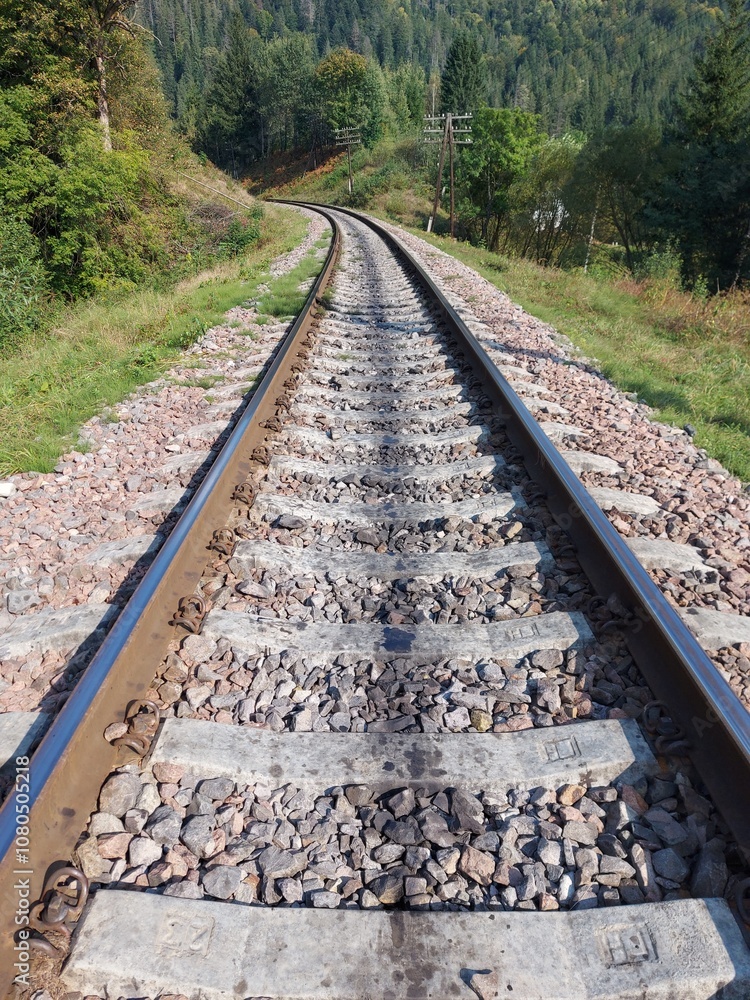 Fototapeta premium Railway tracks, rails and crushed stone. Industrial landscape. Railway junction. Heavy industry, railway track. 
