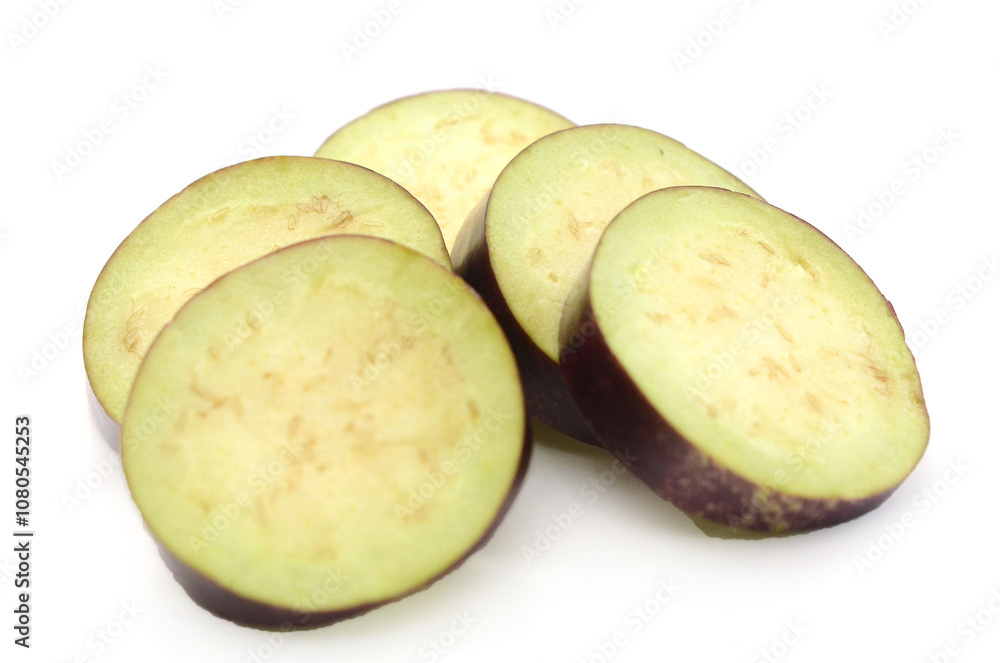 Aubergine, Solanum melongena, egg plant, single ripe fruit and halved fruit next to it - stock photo
Aubergine, Solanum melongena, egg plant, single ripe fruit and halved fruit next to it - stock photo